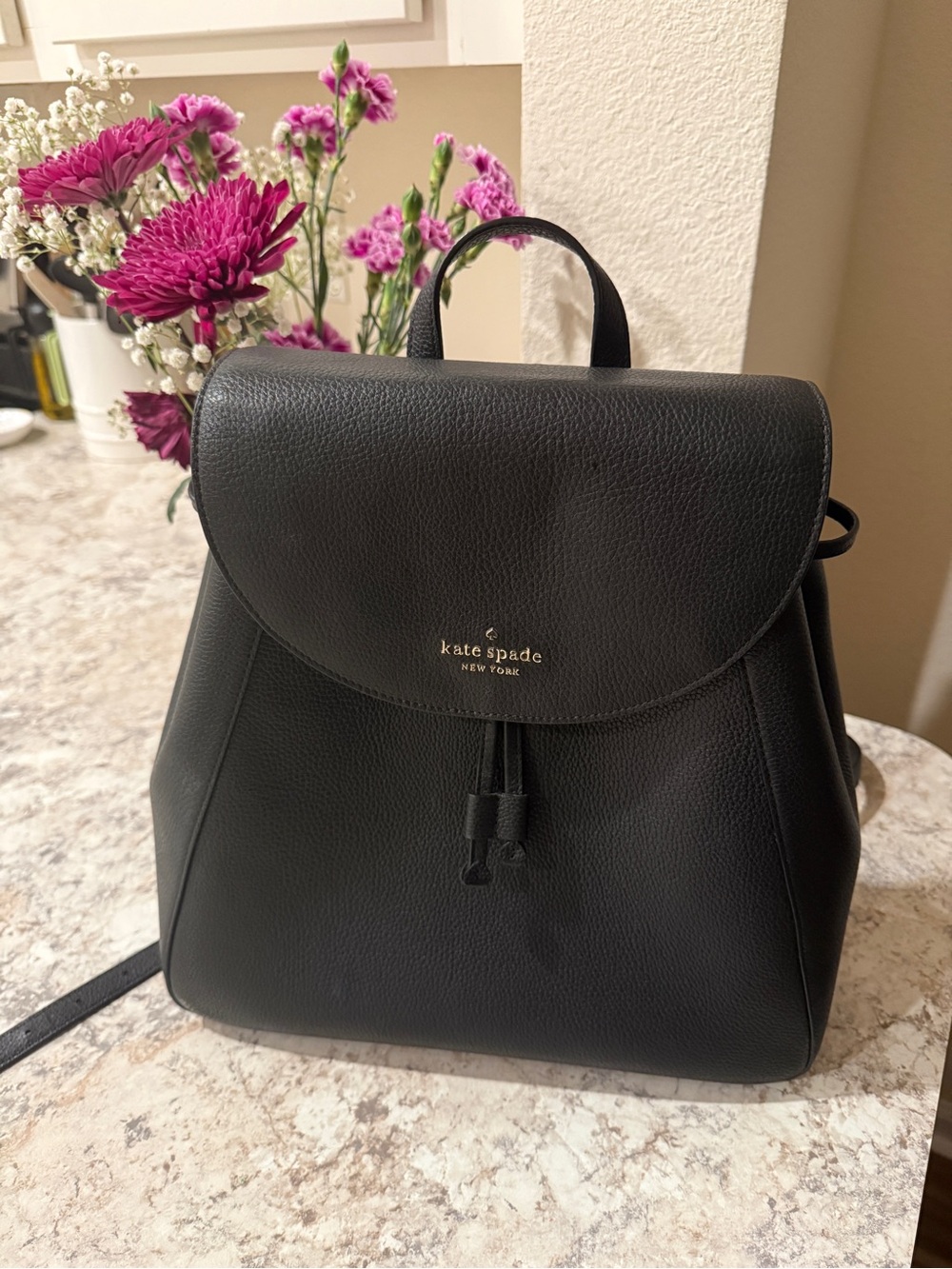 kate spade Black Pebbled Leather Backpack with Gold Logo